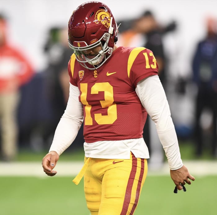 Caleb Williams walks off the field in defeat after losing to Utah.
